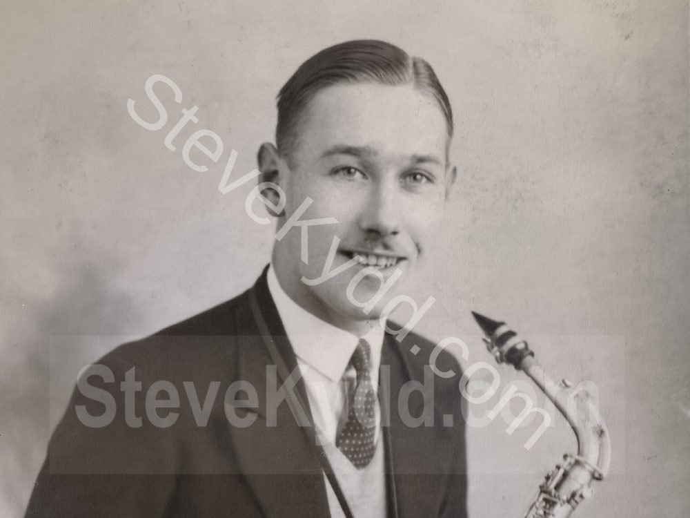 Portrait of man with Alto Saxophone by Los Angeles Portrait Studios