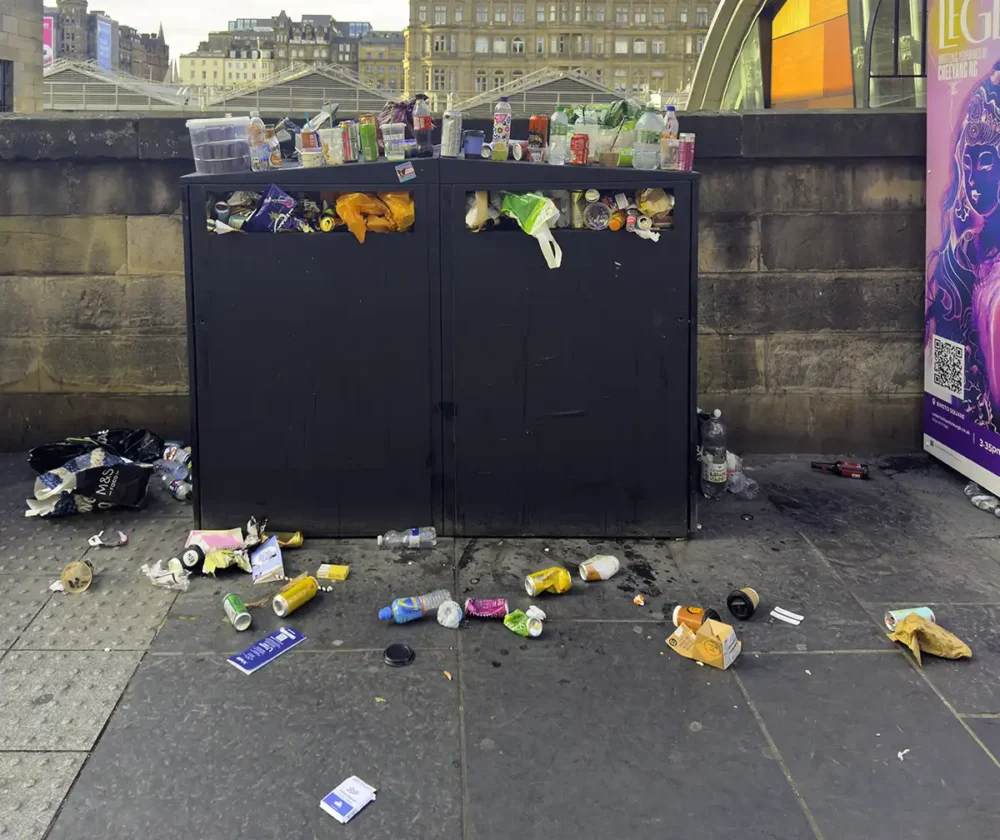 Overflowing refuse bin on Market Street outside Edinburgh Waverley Station